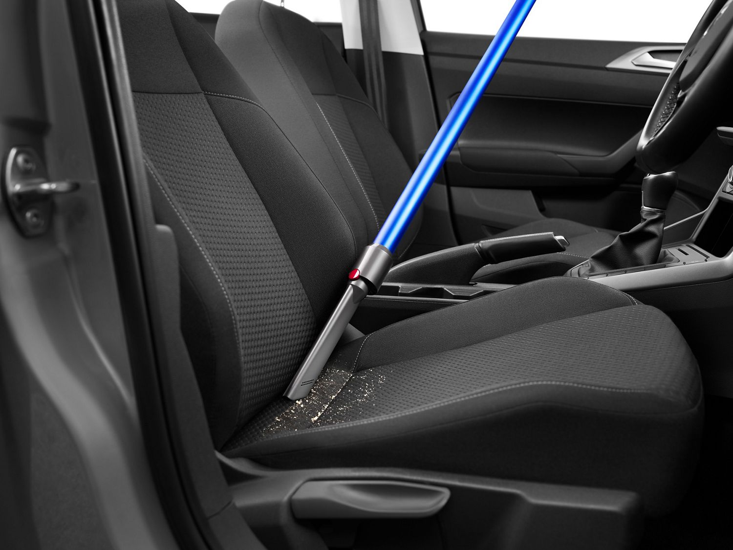 Car cleaning with a Dyson vacuum using the crevice tool 